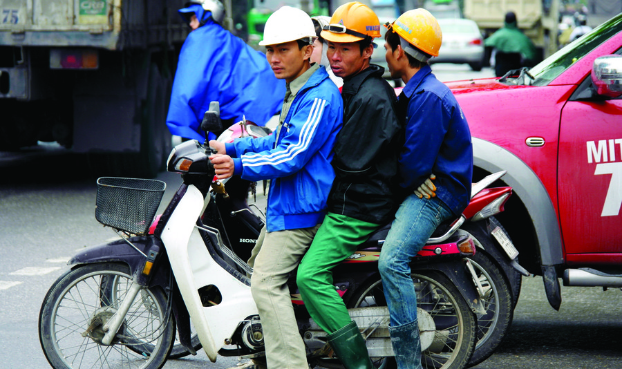 Men on motorcycle in Vietnam